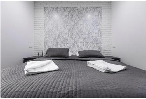 Posteľ alebo postele v izbe v ubytovaní White Apartment
