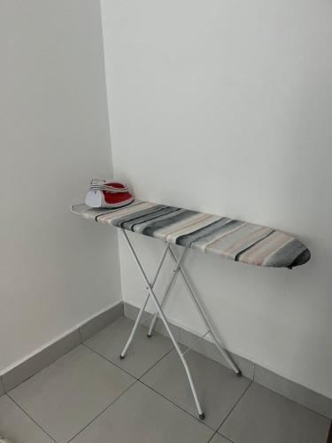 a bed in a corner of a room at Sure Stay Homestay in Simpang Ampat