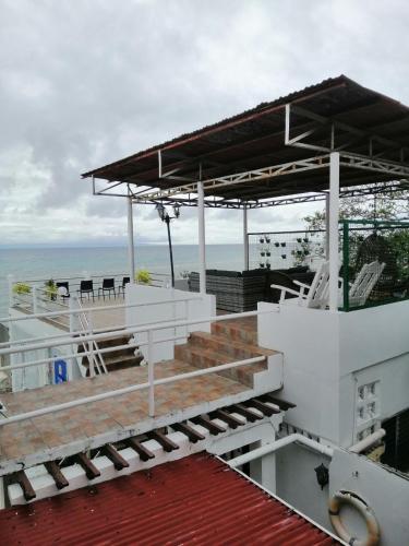 a pavilion on top of a building overlooking the ocean at Germaroze in Oslob