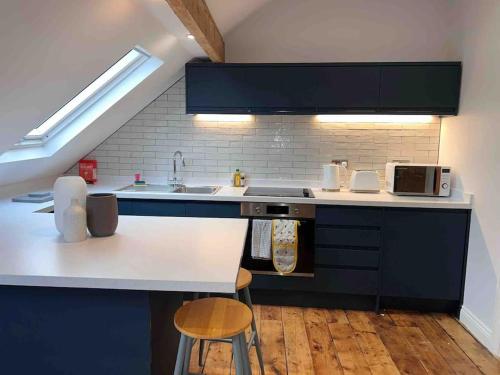 a kitchen with a sink and a counter top at Brynmill Flat in Swansea