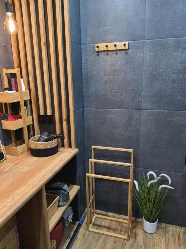 a room with a wooden shelf and a wooden ladder at Nadmorski Apartament in Gąski
