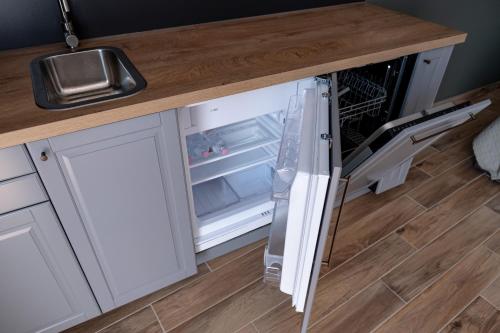 Kuchyň nebo kuchyňský kout v ubytování Griff 1. apartman Pécs