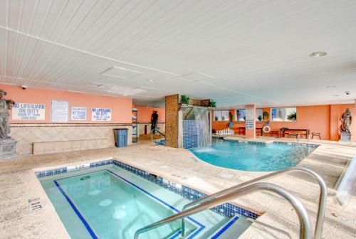 a large pool in a hotel room with a swimming pool at 1BR Beach Condo in Atlantica Resort near Boardwalk in Myrtle Beach