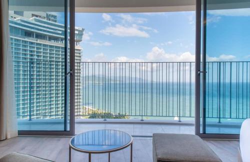 a living room with a view of the ocean at PANORAMA Condotel by HLG in Nha Trang