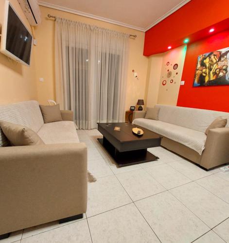 a living room with two couches and a coffee table at Apollo 2 - Luxury Apartment in Katerini