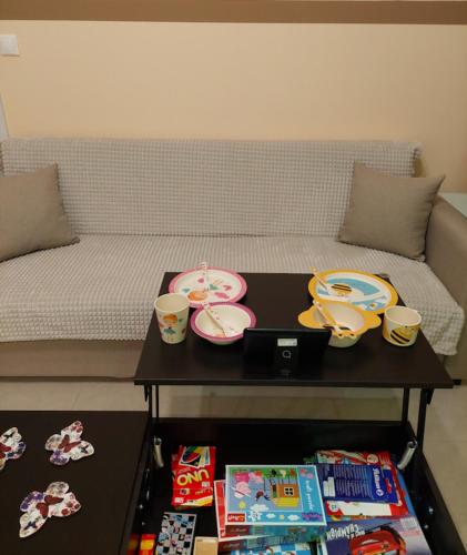 a table with plates and cups on top of a bed at Apollo 2 - Luxury Apartment in Katerini