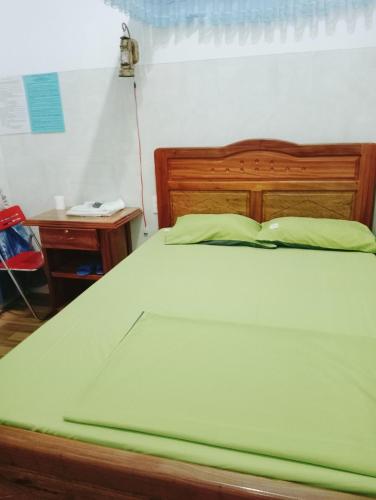 Una cama o camas en una habitación de Homestay Nang Nghieng