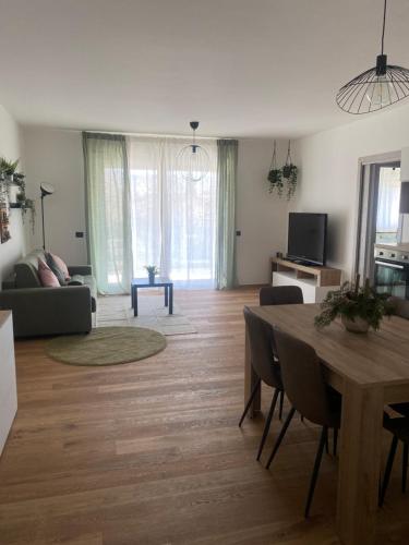 a living room with a table and a couch at Atmosphera home in Castel di Sangro