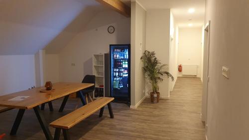 a dining room with a table and a drink machine at Messe- und Monteurzimmer in Müllingen in Sehnde