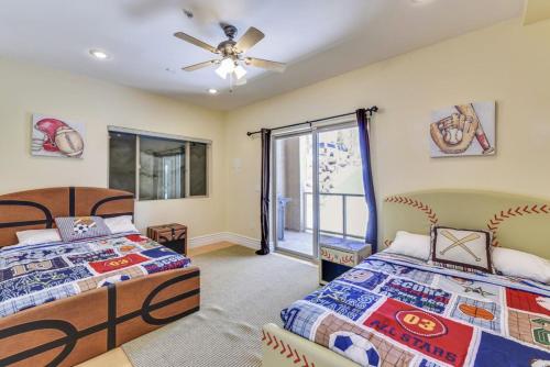 a bedroom with two beds and a ceiling fan at Freestyle in Brian Head