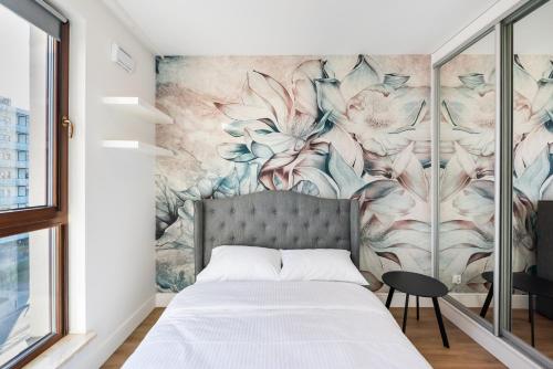 Posteľ alebo postele v izbe v ubytovaní Wola Bloom Apartment