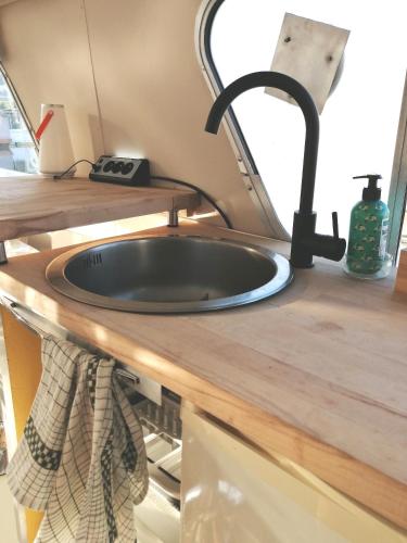 a sink in a kitchen in an rv at Esprit Péniche in Nantes