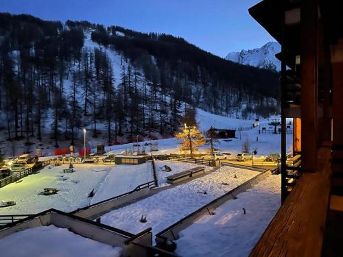 a view of a ski resort in the snow at Over The Snow Apartment in Borgata Sestriere