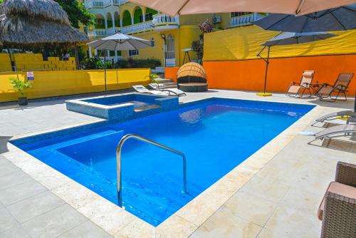 The swimming pool at or close to Takuma Boutque Hotel Hotel Rooms & Suites