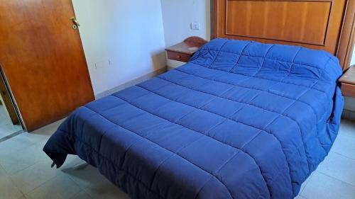 DTOS Villa del Lago tesisinde bir odada yatak veya yataklar