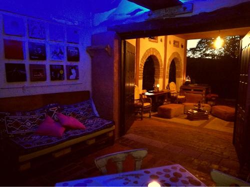 a living room with a couch with pillows on it at Krasberry Ježev brlog in Komen
