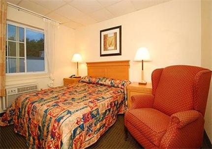 Säng eller sängar i ett rum på Inn at Monticello