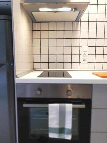 Kuchyň nebo kuchyňský kout v ubytování Mazi Apartments Suite