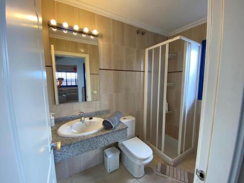 a bathroom with a sink and a toilet and a shower at Villa Maria Luisa in Playa Blanca
