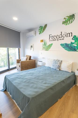 a bedroom with a large bed in a room at Casa do Outeiro in Arcos de Valdevez