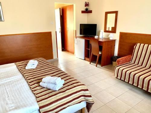 Posteľ alebo postele v izbe v ubytovaní Ligetalja Termál Apartmanok