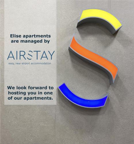 a sign with a s logo on a wall at Elise Apartment Airport by Airstay in Spáta