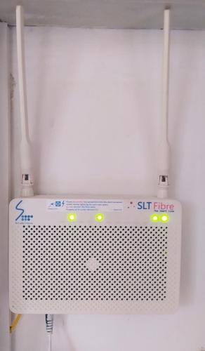 a white object with yellow lights on a wall at Lake View Villa - Tangalle in Tangalle