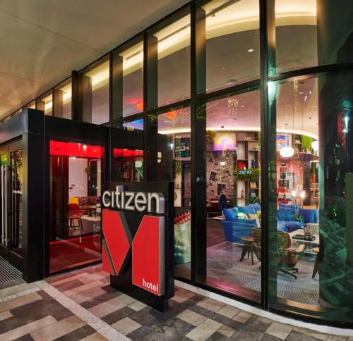 a store with a cheetah sign in front of a building at citizenM Miami Worldcenter in Miami