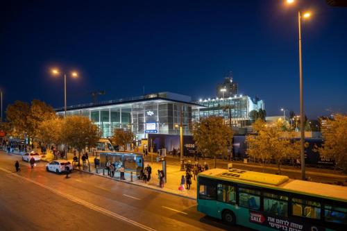 a bus parked in front of a building at night at Jerusalem Gold Hotel in Jerusalem
