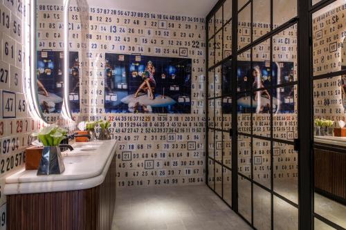 a bathroom with a sink and a tile wall at Sublime Lisboa in Lisbon