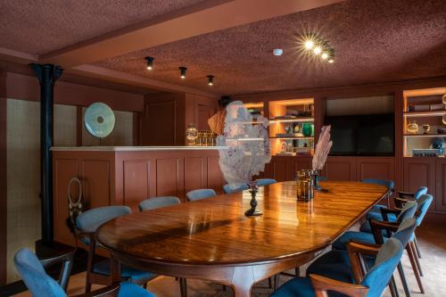a dining room with a wooden table and chairs at Sublime Lisboa in Lisbon
