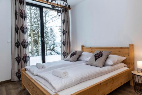 Posteľ alebo postele v izbe v ubytovaní udanypobyt Apartamenty Krzeptówki Potok