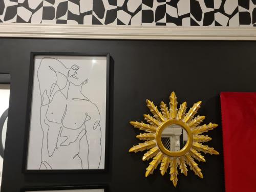 a drawing of a man riding a horse next to a mirror at Smithgrove Guesthouse in Pietermaritzburg