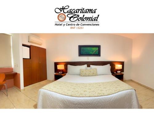 a bedroom with a bed and two tables with lamps at Hotel Hacaritama Colonial in Villavicencio