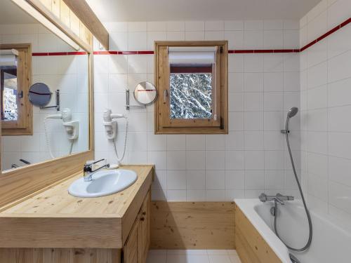 a bathroom with a sink and a shower and a tub at Appartement rénové avec 2 suites, balcon et poêle à bois, proche centre et remontées mécaniques, Megève - FR-1-569-39 in Megève