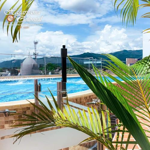 a view of the pool from the balcony of a building at Hotel Hacaritama Colonial in Villavicencio