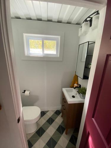 A bathroom at Ski Hike Swim Container Cabin