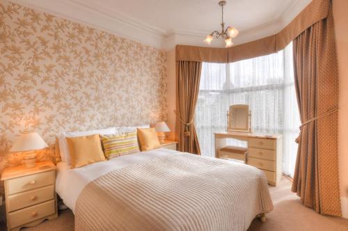 Ένα ή περισσότερα κρεβάτια σε δωμάτιο στο Avron House