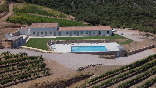 an aerial view of a house with a swimming pool at Tenuta Paltusa in Calangianus