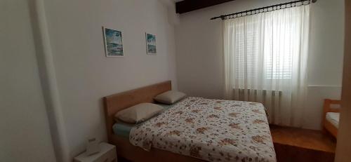 Posteľ alebo postele v izbe v ubytovaní Apartments Dida moj