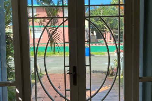 an open door with a view of a beach at Authentic Puerto Rico - Near Beach & Old San Juan in Toa Baja