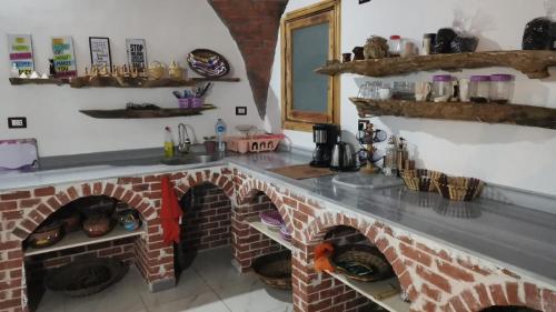 A kitchen or kitchenette at tala accommodation