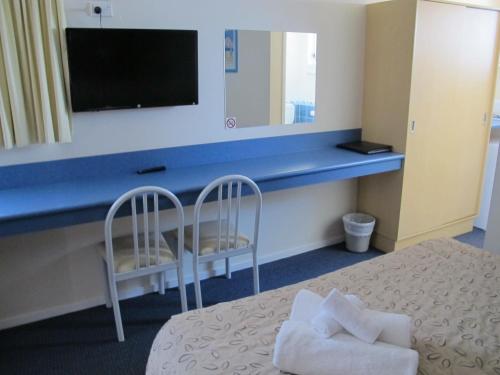 Postel nebo postele na pokoji v ubytování Merimbula Gardens Motel