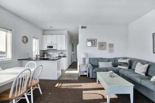 a living room with a couch and a table at The Hermitage at Napeague in Amagansett
