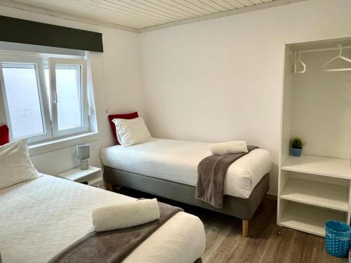 Ένα ή περισσότερα κρεβάτια σε δωμάτιο στο Granny´s Guesthouse