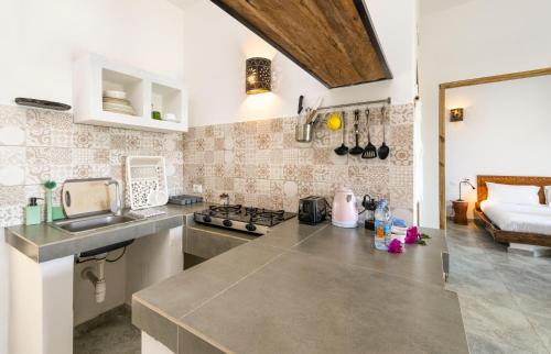 a kitchen with a sink and a counter top at Surfescape Zanzibar in Kiwengwa