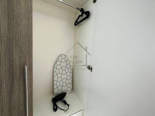 a room with a wall with a mirror and a shelf at PD D'Wharf Duplex 3BR - Full Seaview (Up To 12 Pax) in Port Dickson