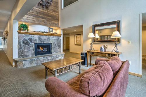 a living room with two couches and a fireplace at Ski-InandSki-Out Copper Mountain Condo with Balcony! in Copper Mountain