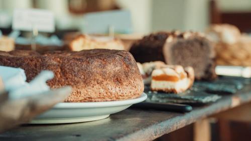 a table with a plate of bread on a table at Vieja Posada Hotel Histórico in Cafayate