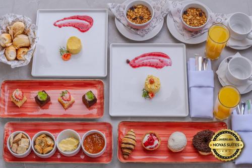 a table topped with trays of food and drinks at Serhs Natal Grand Hotel & Resort in Natal